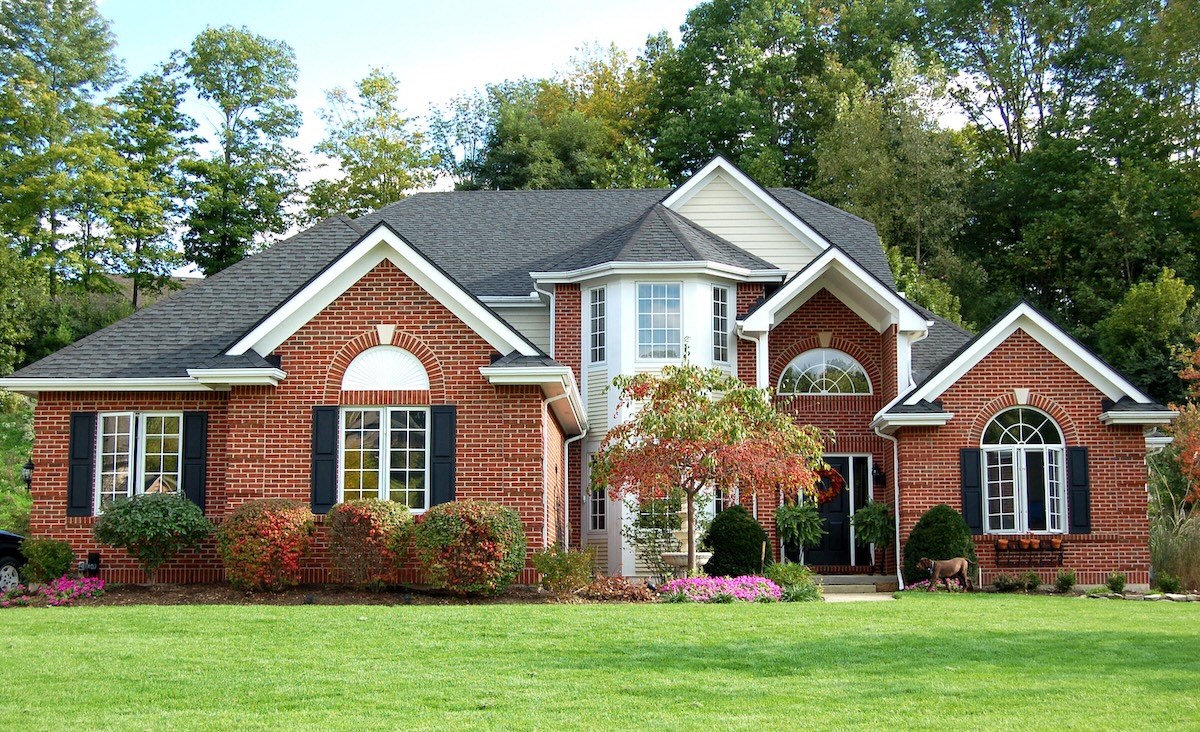 brick home with new siding