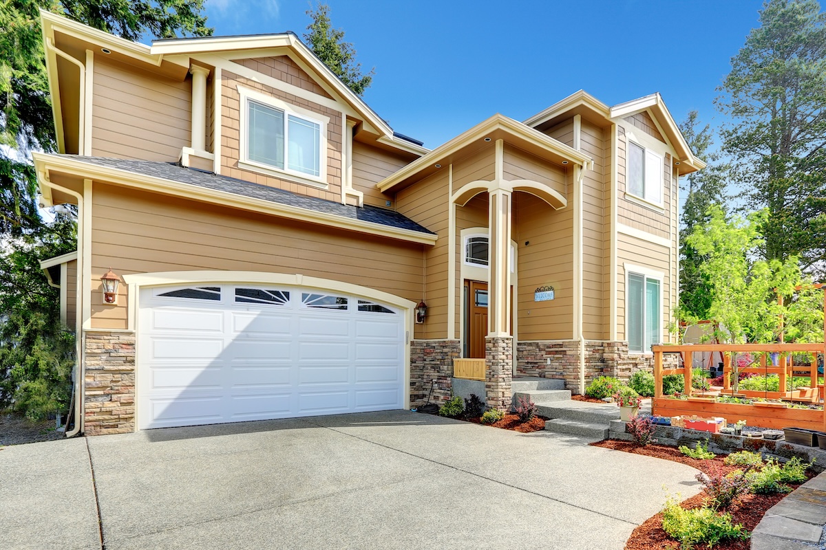 Big house with high porch and stone trim