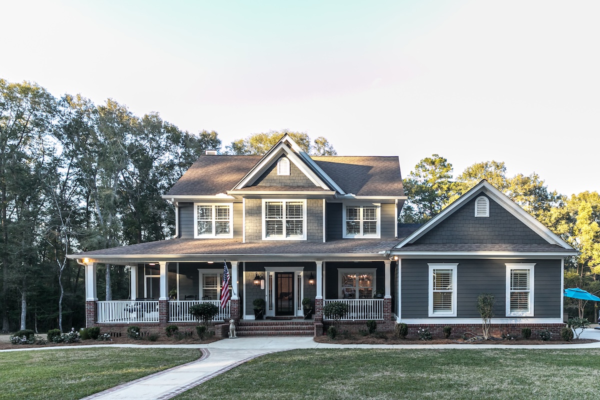 a house with a lawn and a porch