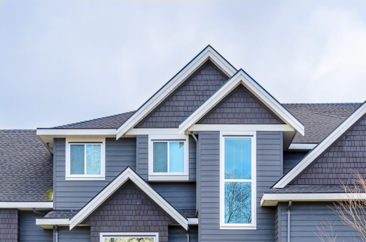 The top of the house with nice window. siding replacement cost