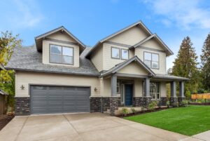 Exterior of new home on bright sunny day with blue sky