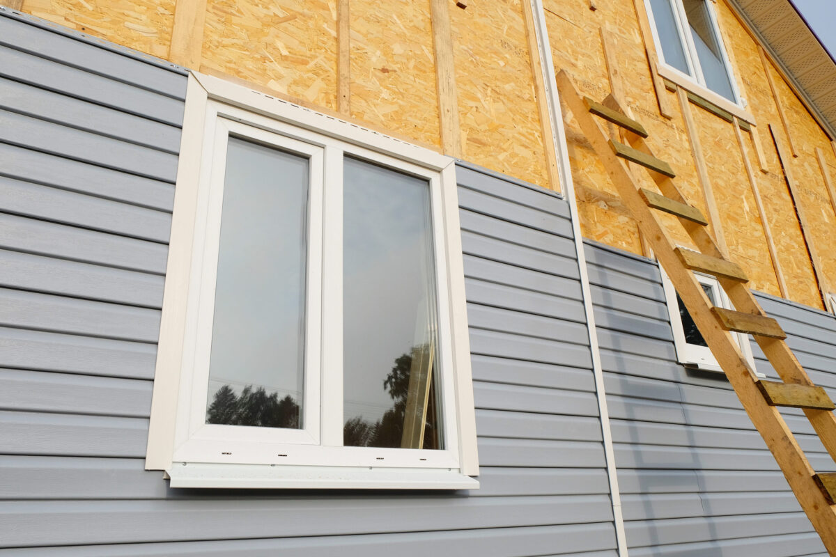 siding covering the wall of a house under construction siding repair cost