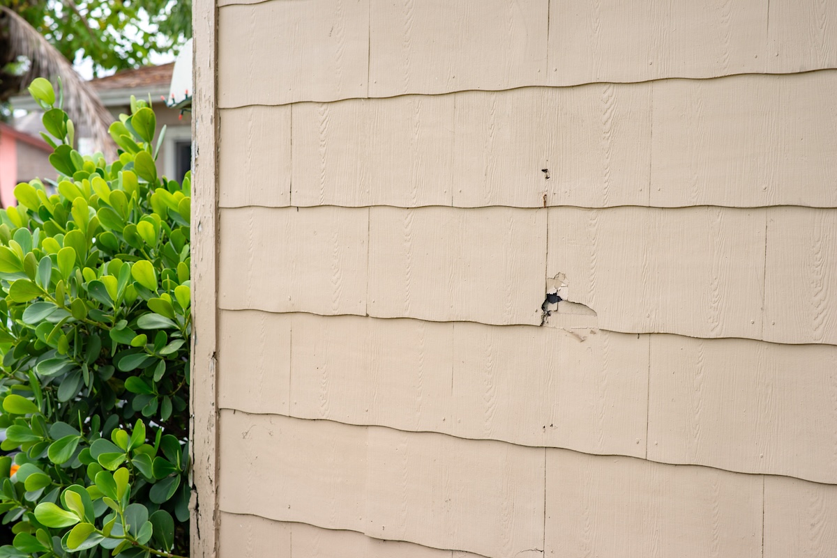 Asbestos siding on exterior house wall at a South Florida neighborhood.